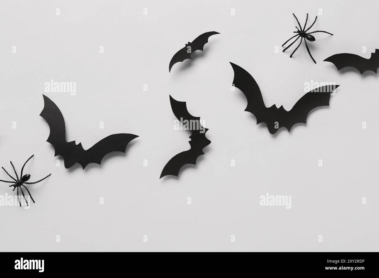 Paper bats and spiders for Halloween party on grey background Stock ...