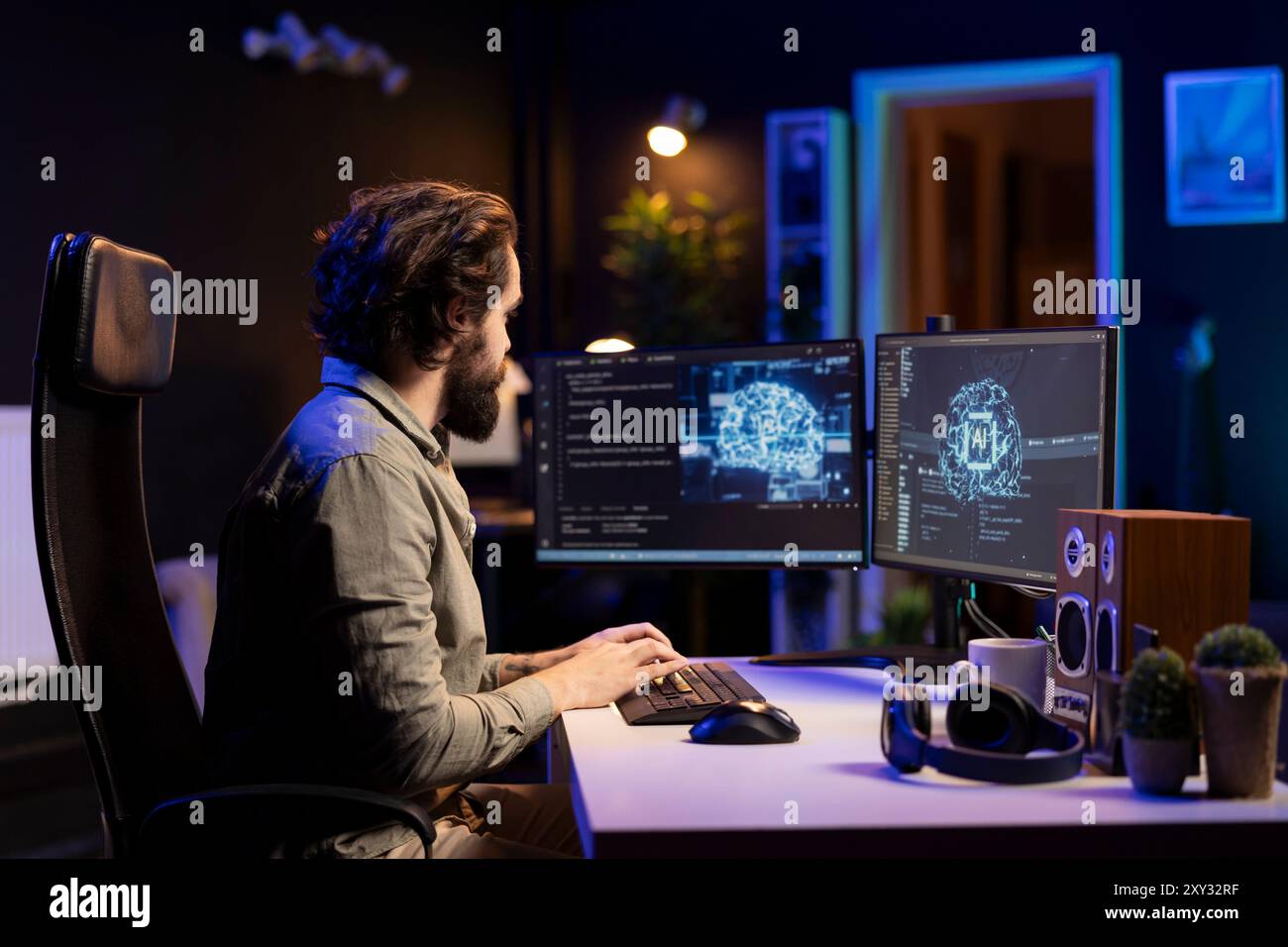 Developer using computer to update artificial intelligence machine ...