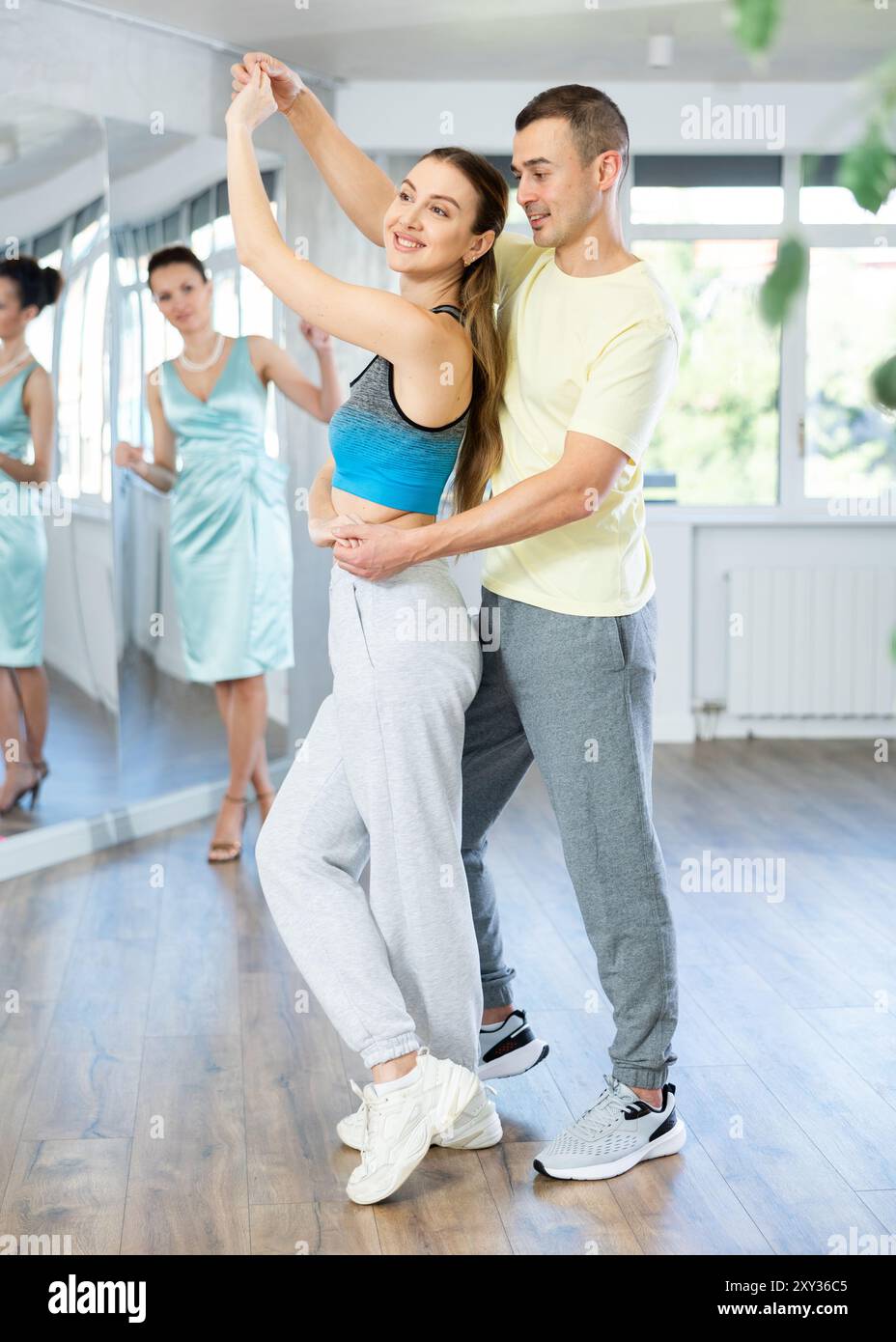 Samba Class Positive man and woman practicing samba in dance class Stock Photo - Alamy