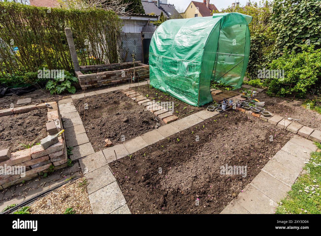 Early spring view of a vegetable garden with a polyhouse Stock Photo ...