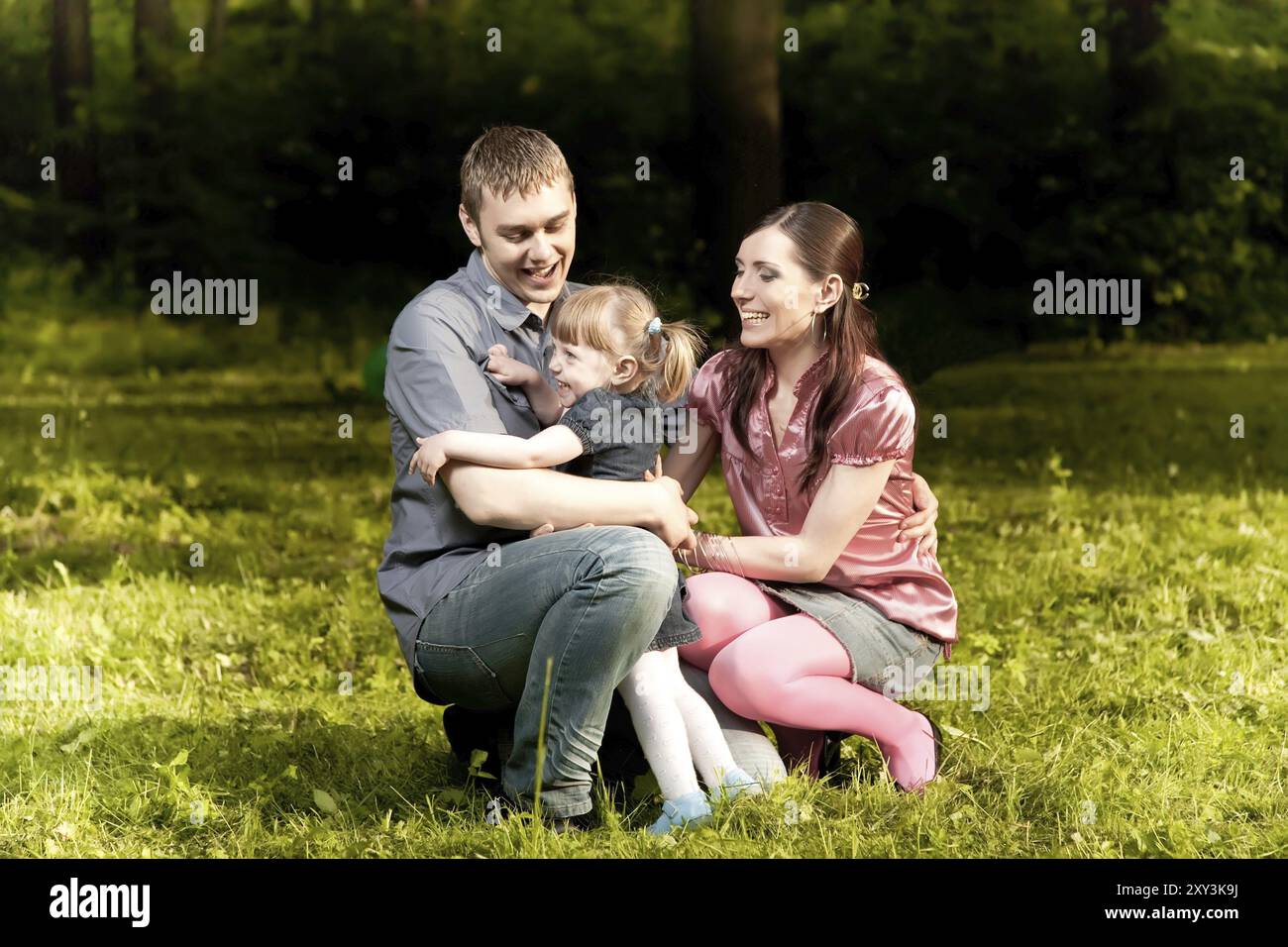 Happy Family in The Park Stock Photo - Alamy