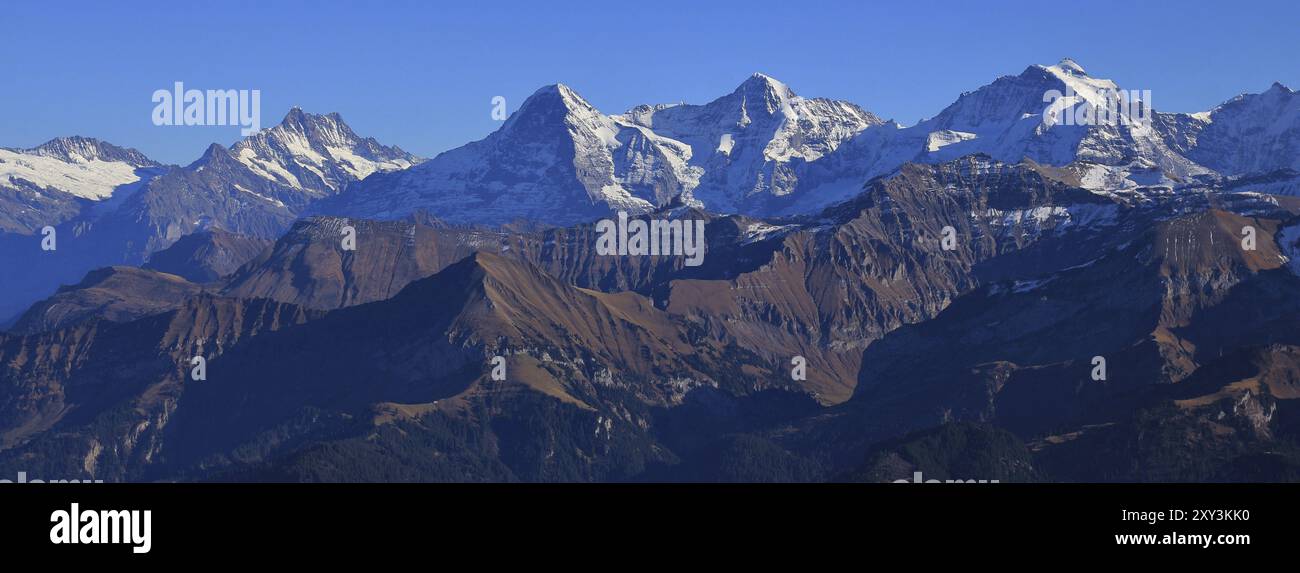 Famous mountain range Eiger, Monch and Jungfrau on a clear autumn day ...