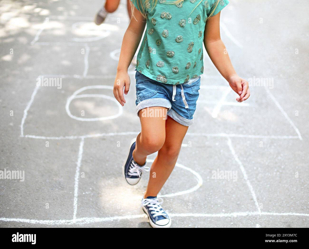 Kid playing hopscotch on playground outdoors, children outdoor ...