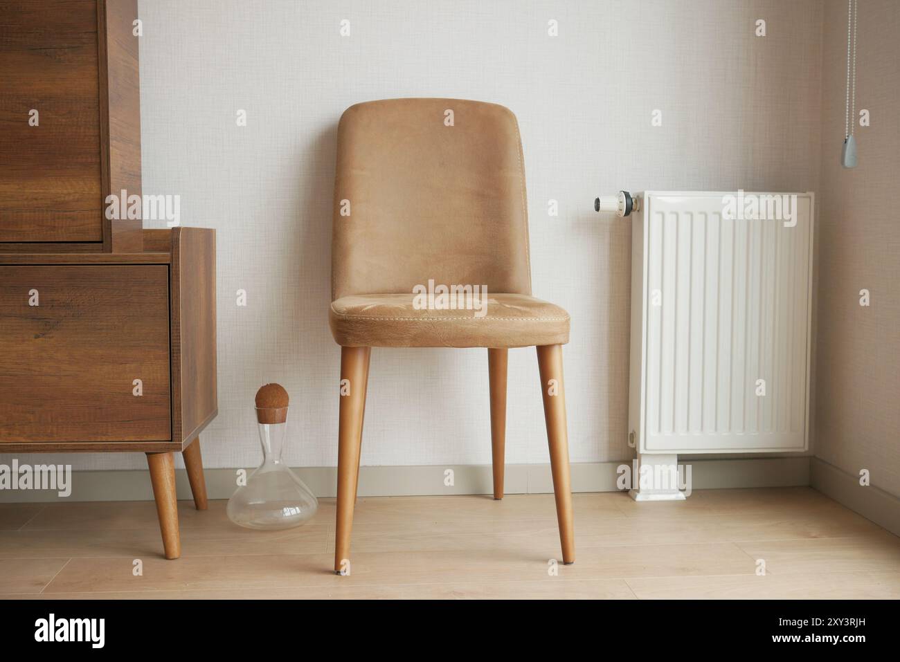 A Cozy Modern Interior Featuring a Stylish Chair Alongside an Efficient ...