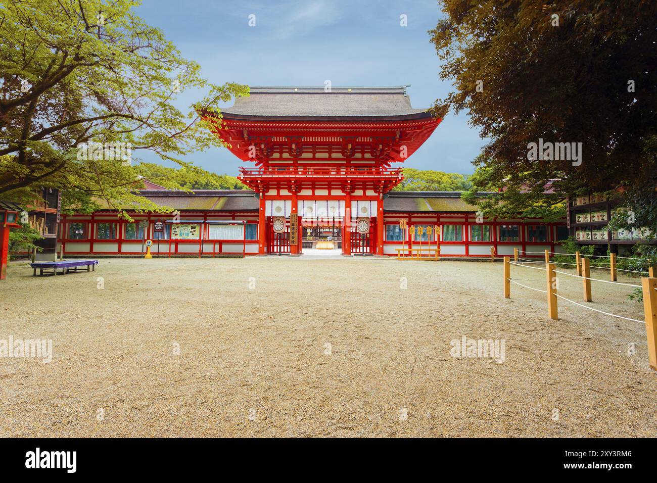 Clear blue sky at front entrance tower gate and open door to Shimogamo ...