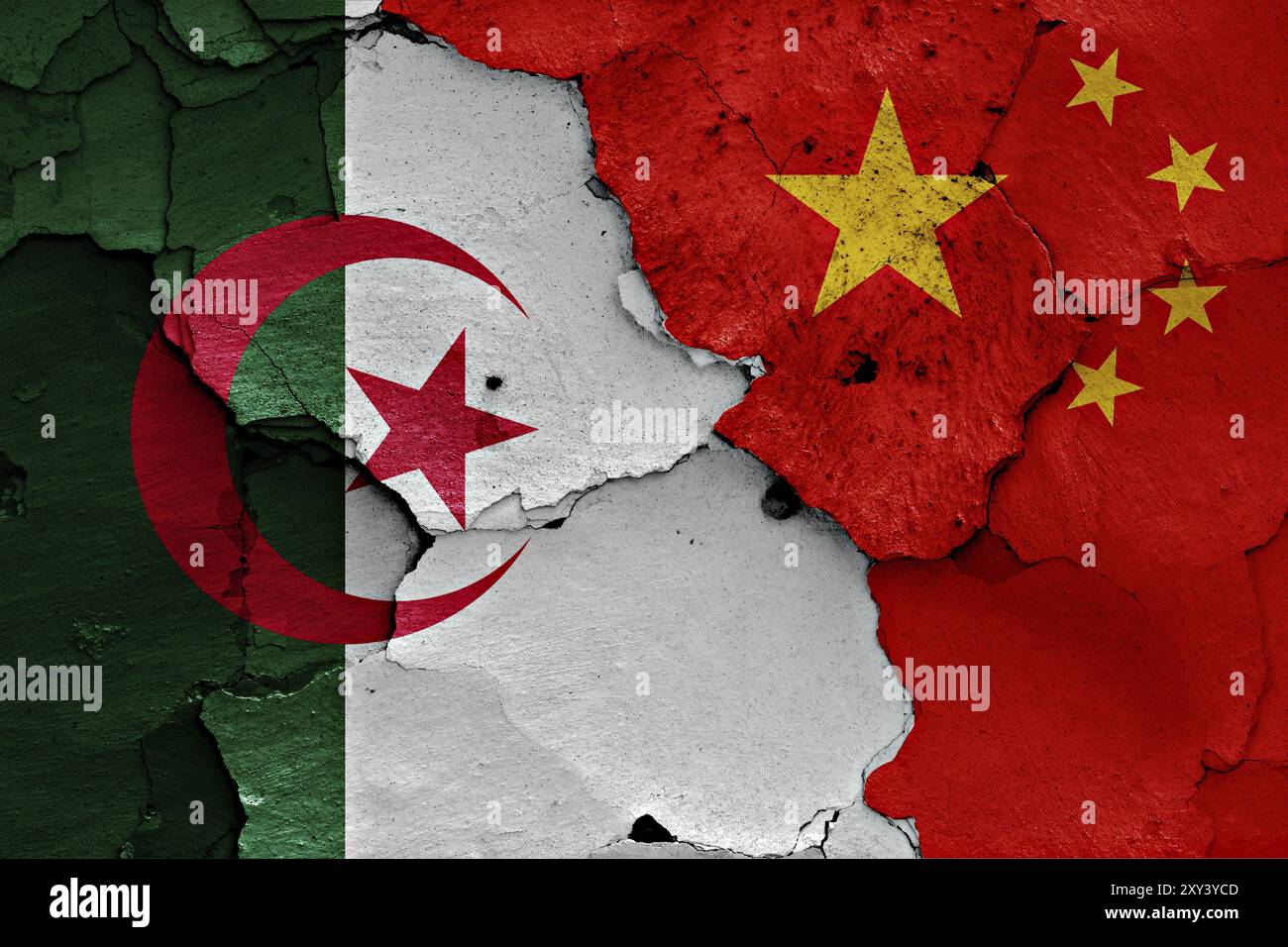 Flags of Algeria and China painted on cracked wall Stock Photo