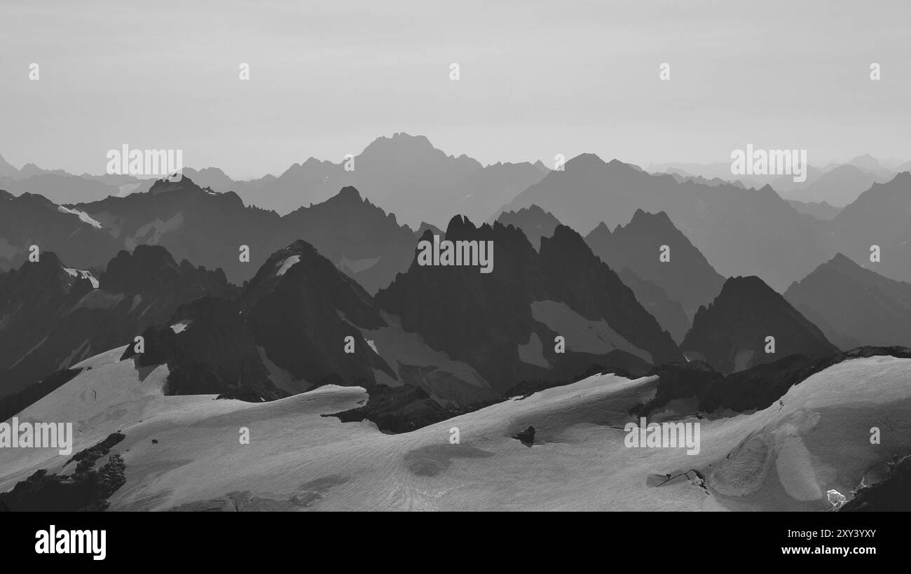 Rugged mountain ranges in Switzerland. View from mount Titlis towards mount Oberalpstock. Many peaks Stock Photo