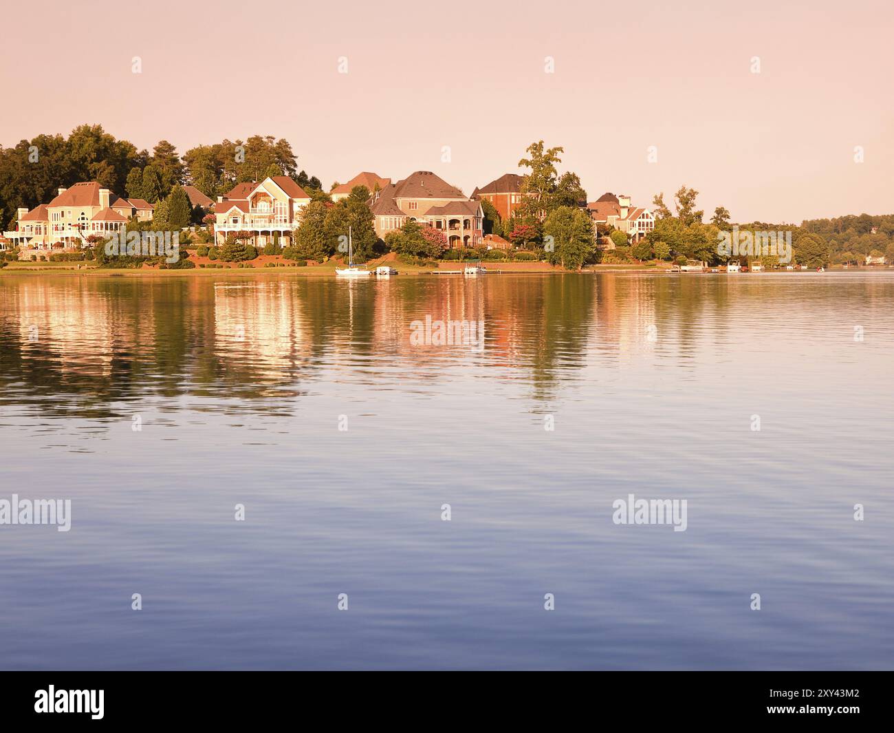 Idyllic countryside view with lake and house on sunset Stock Photo - Alamy