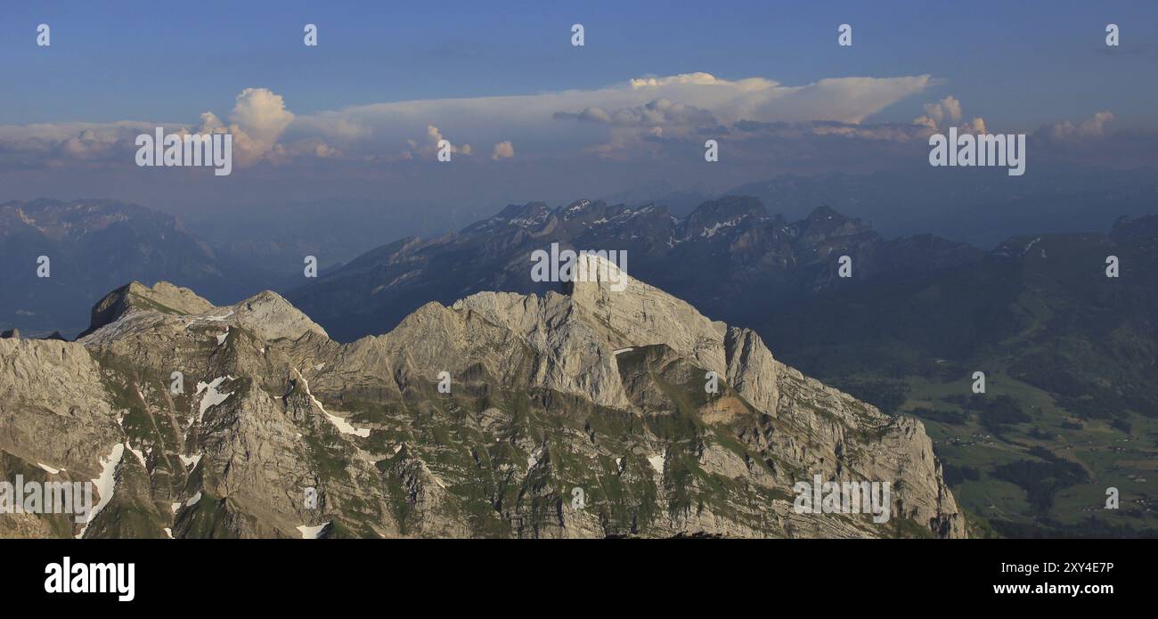 Summer day on mount Santis. View of the mountains Wildhuser Schofberg ...