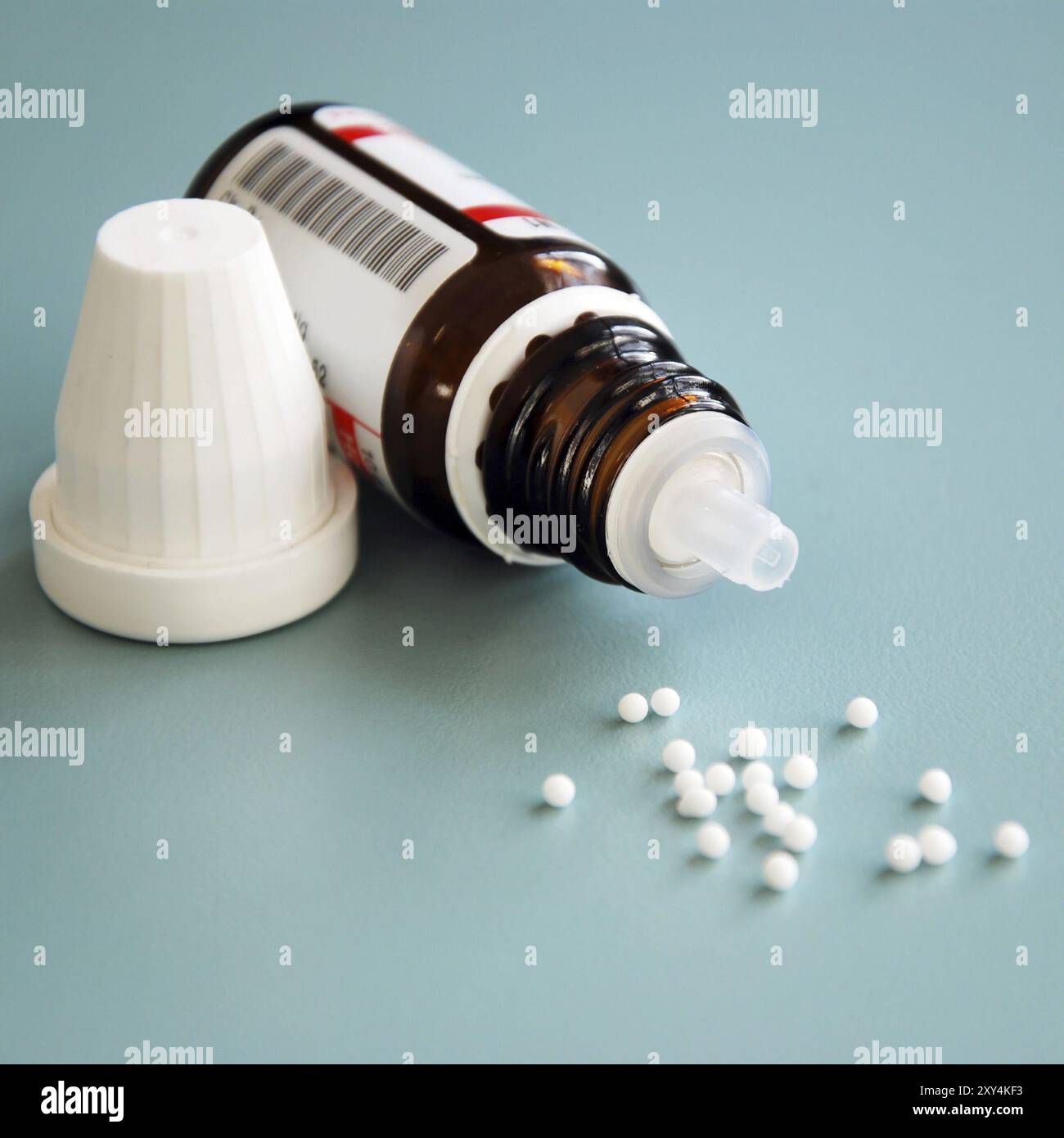 Close-up of homeopathic globule pills with bottle Stock Photo