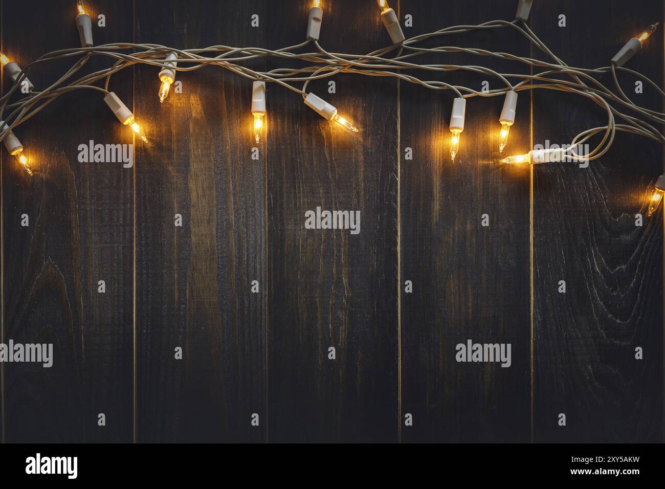 Christmas background lights and copy space on old wooden board ...
