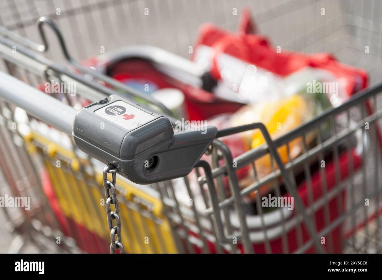 Half-full shopping trolley with groceries Stock Photo