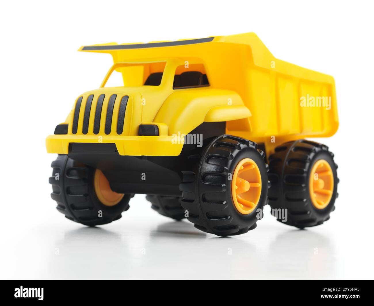 Yellow toy dump truck isolated on white background Stock Photo - Alamy