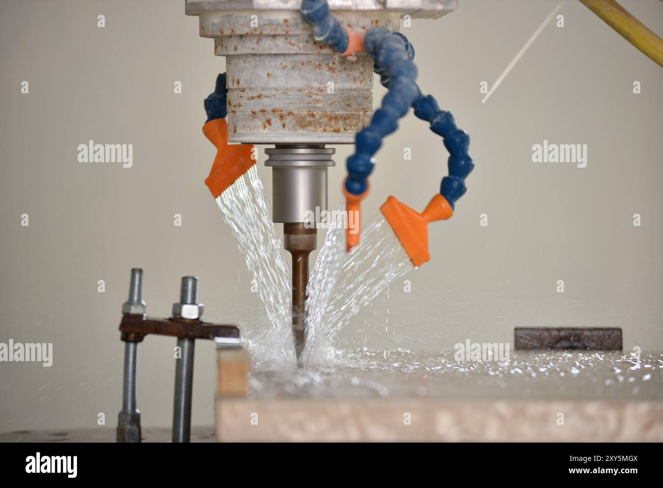 Robot working on milling sculpture in natural stone Stock Photo