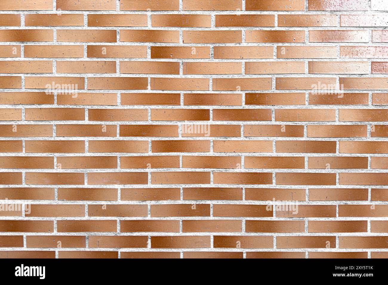 Smooth brown brick exterior wall as abstract architectural background Stock Photo