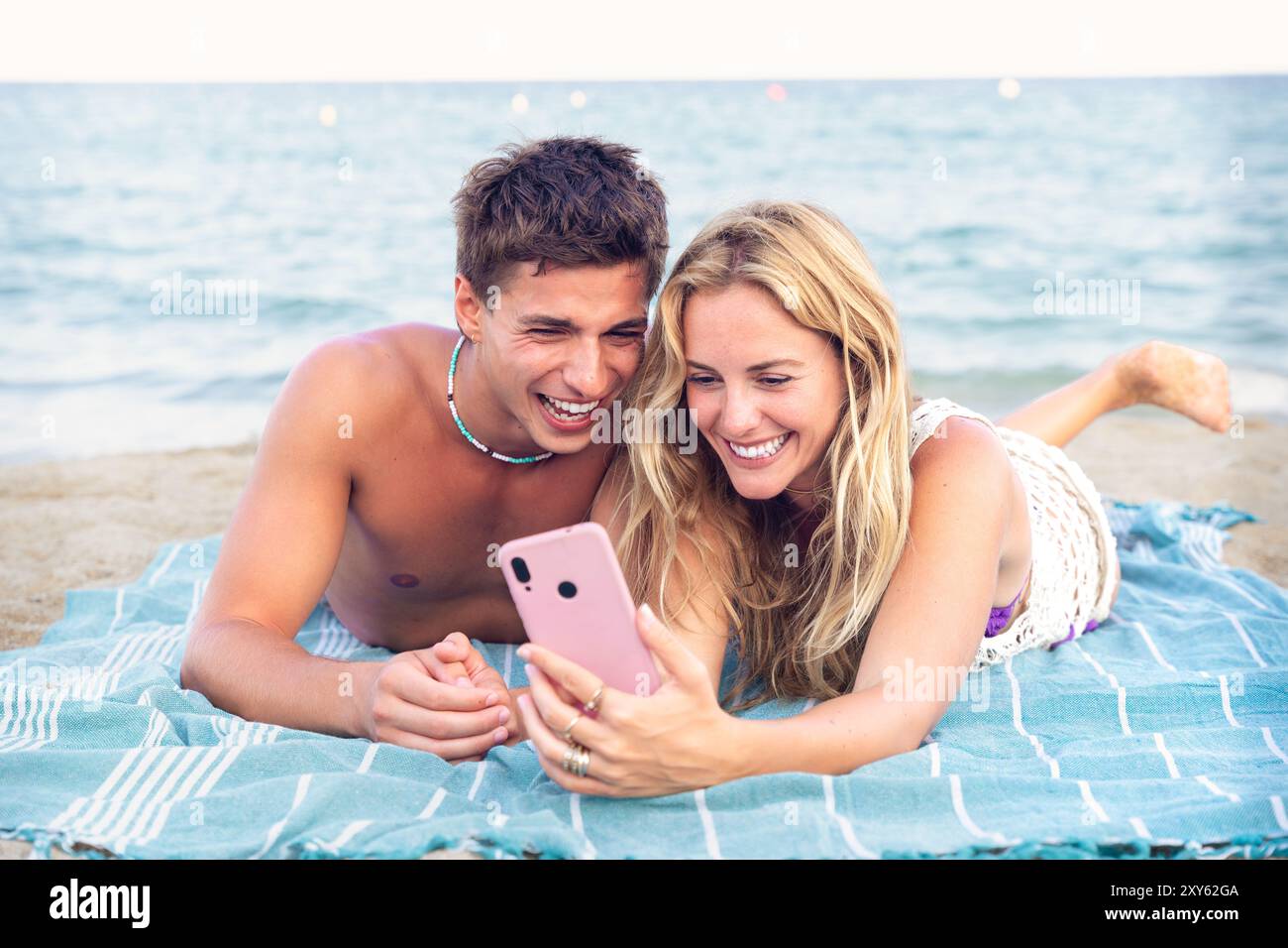 Young couple using smartphone app outdoors. Stock Photo