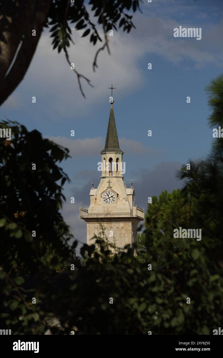 Clock tower of the Franciscan Catholic Church of St. John the Baptist ...