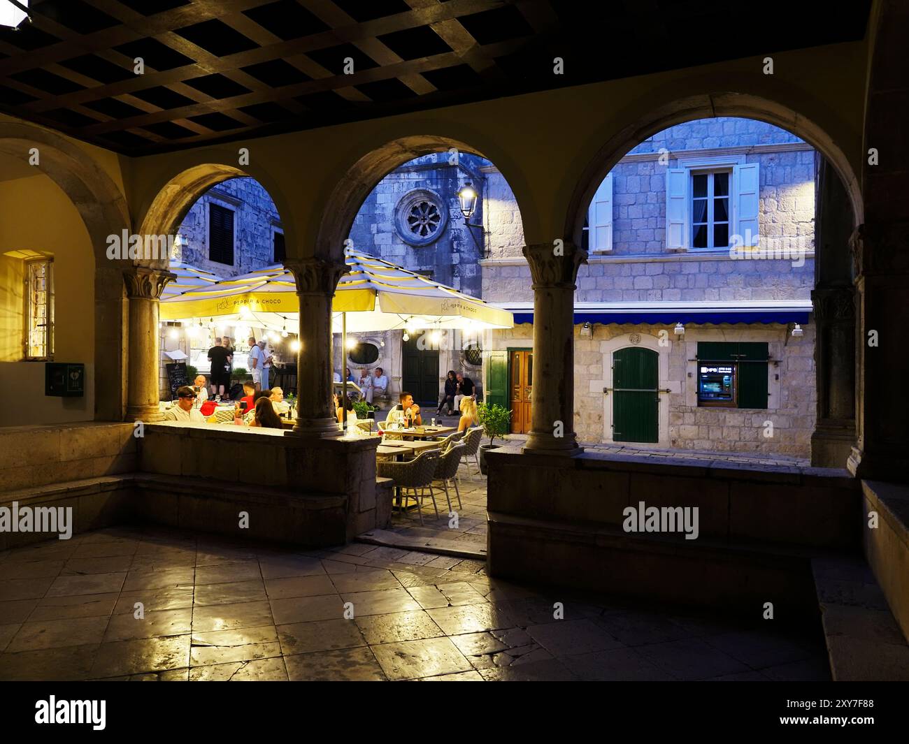 Looking out of the Loggia inside the Land Gate in the Old Town at dusk Korcula Town Korcula Dalmatia Croatia Stock Photo