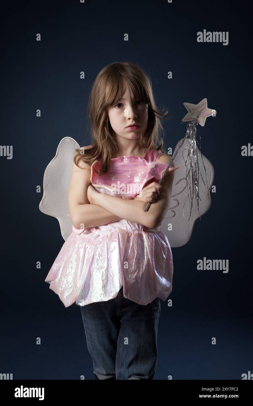 Little girl dressed up as a fairy with a magic wand Stock Photo - Alamy