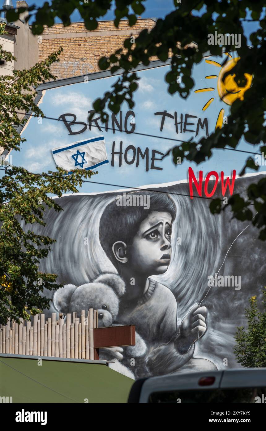 'Bring them home now' wall art graffiti by Israeli artist Benzi Brofman at Oranienburger Strasse in Berlin Mitte, Germany, Europe (EDITORIAL USE ONLY) Stock Photo