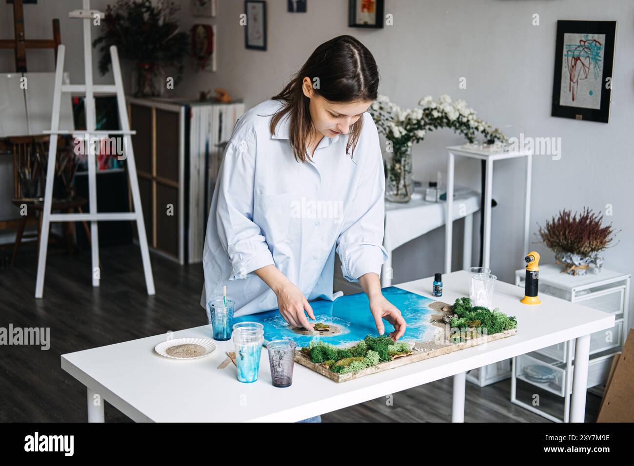 Creating beautiful epoxy resin art in a bright studio with a focus on ...