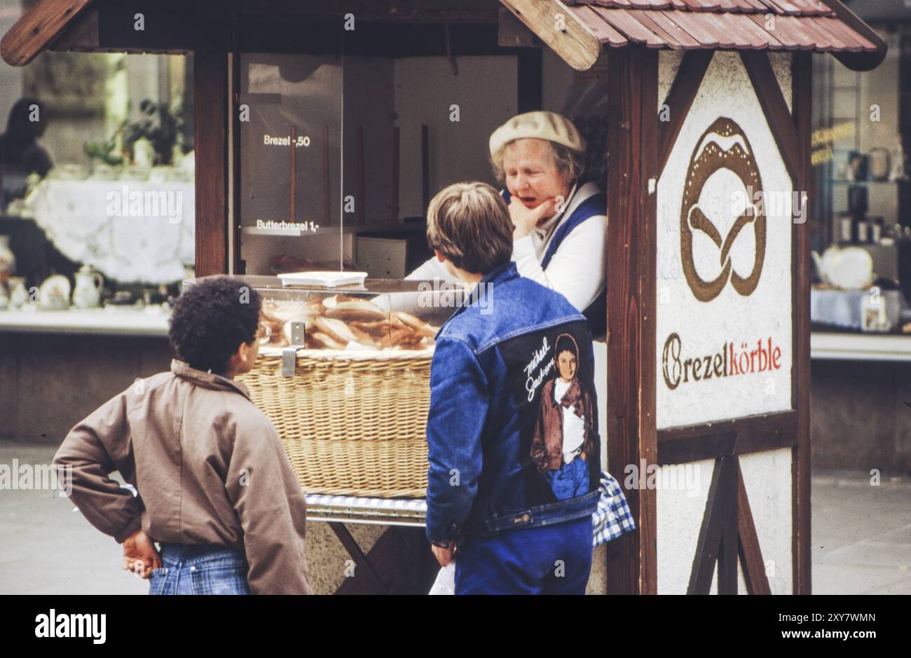 Older saleswoman in a stall selling pretzel baskets on 