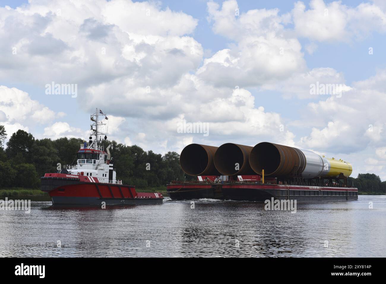 Tugboat : We'll pull you where you want… Tugboat Pulling Industrial Ship Stock Photo - Download Image