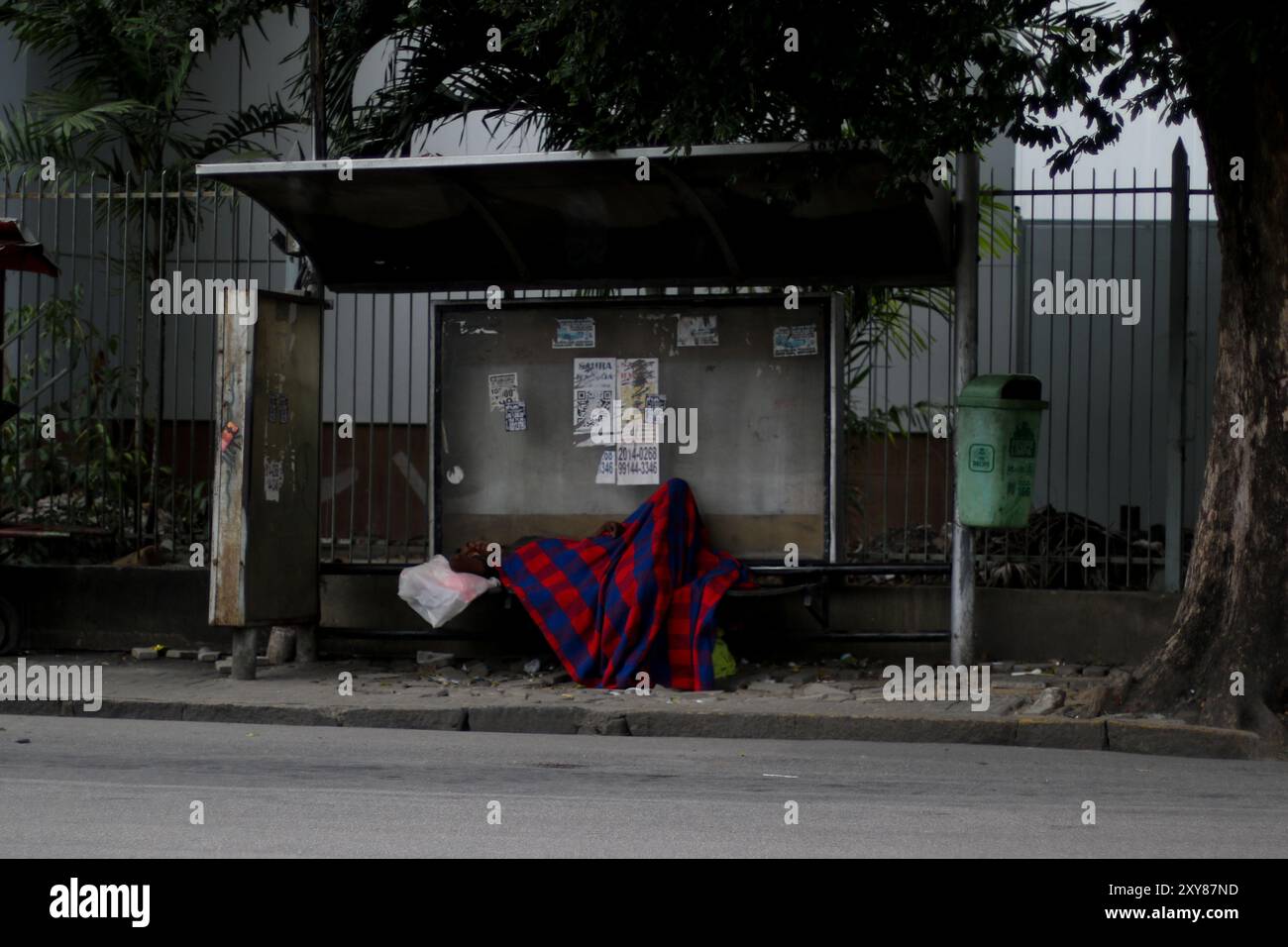Homeless Bus Stop Homeless sleeping on bus hi-res stock photography and images - Alamy