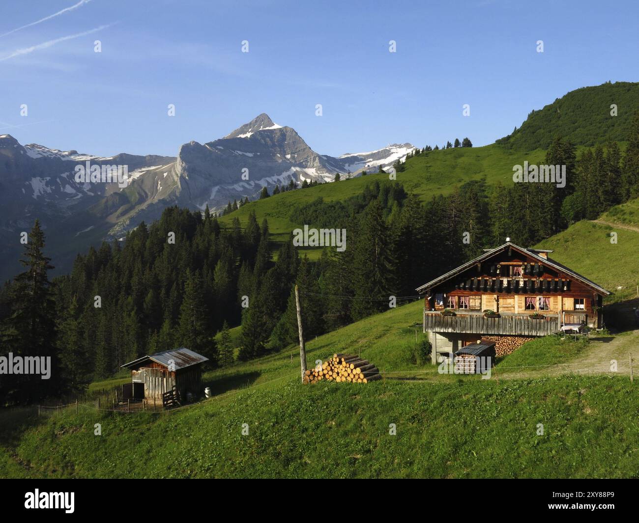 Farm house and Oldenhorn, scene in the Bernese Oberland Stock Photo