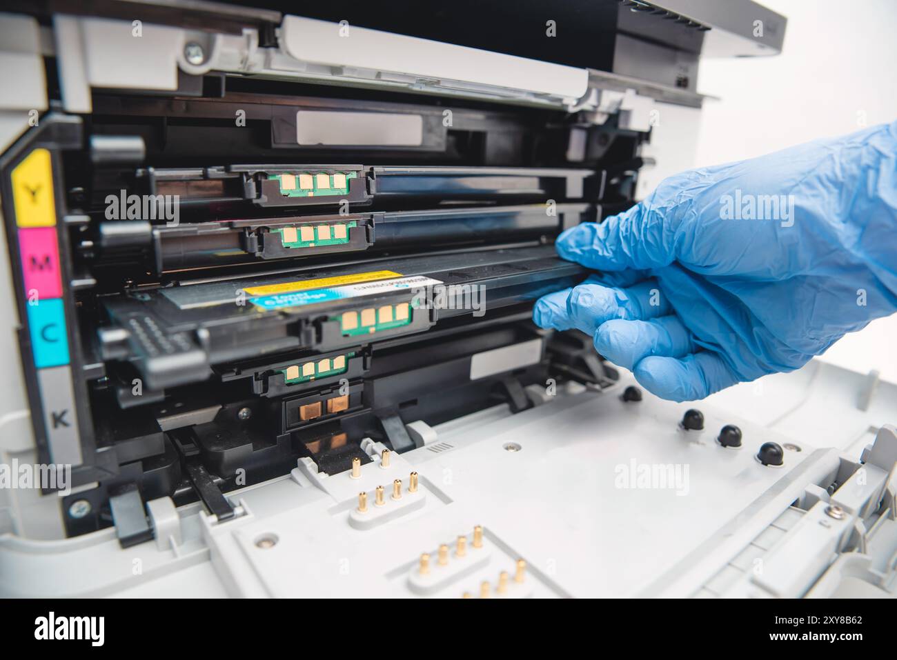 Man replacing cartridge in printer at office. Laser printer supplies Stock Photo