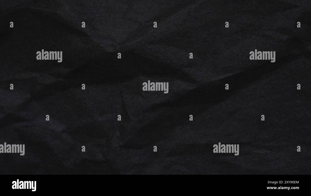 Black abstract background texture. Dark crumbled paper texture. Stock Photo