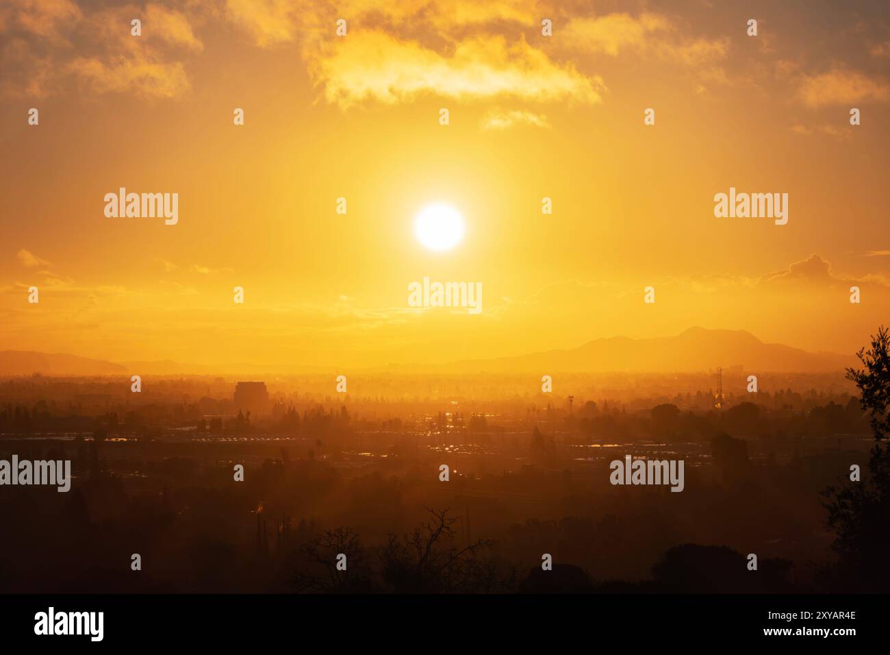 Los Angeles morning sun bursting through layers of fog above the San ...