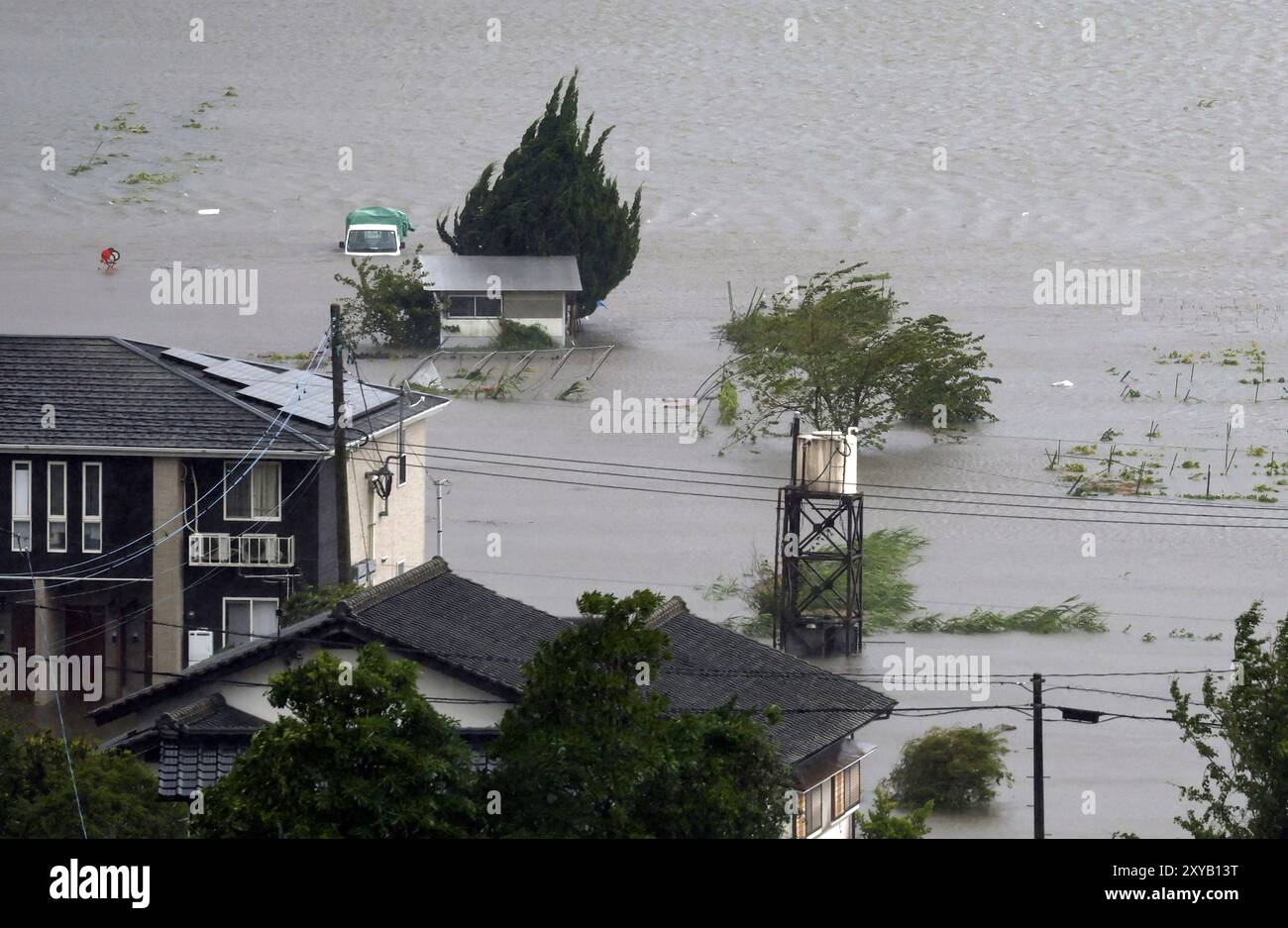 Farmland along a river is flooded by heavy rains caused by a typhoon in