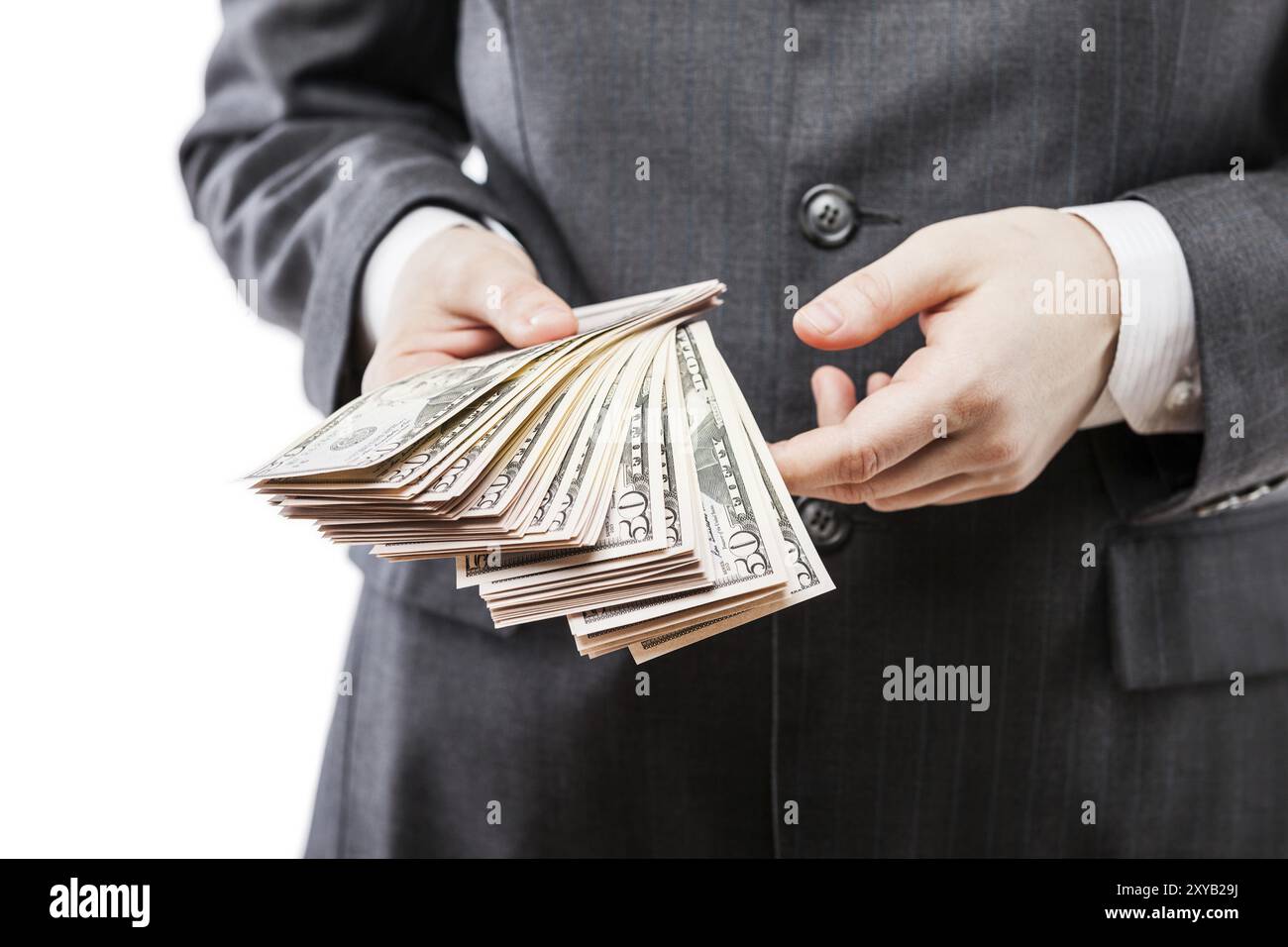 Business success concept, businessman in black suit hand holding US dollar currency money cash Stock Photo