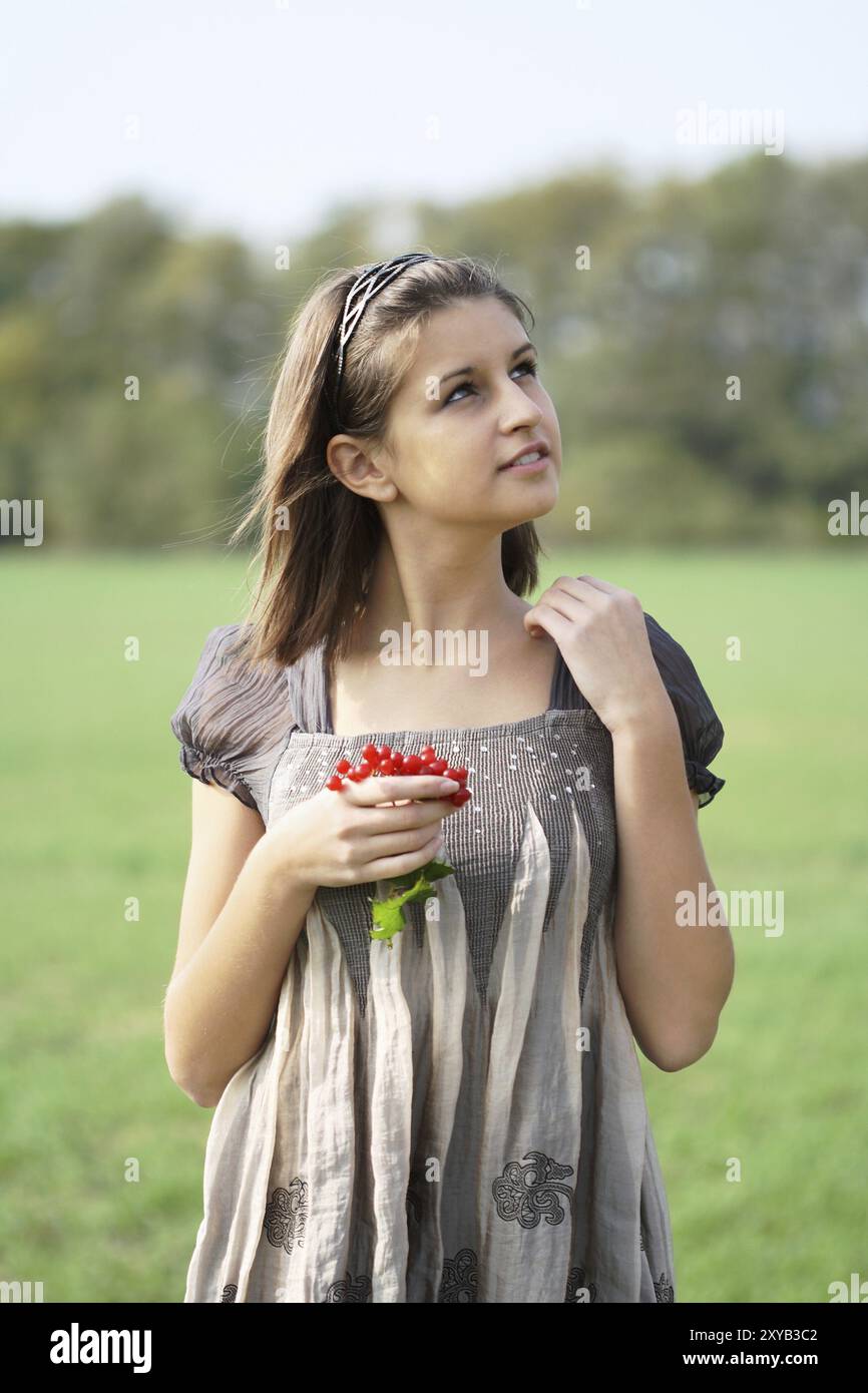Portrait of the young girl on the forest background Stock Photo - Alamy