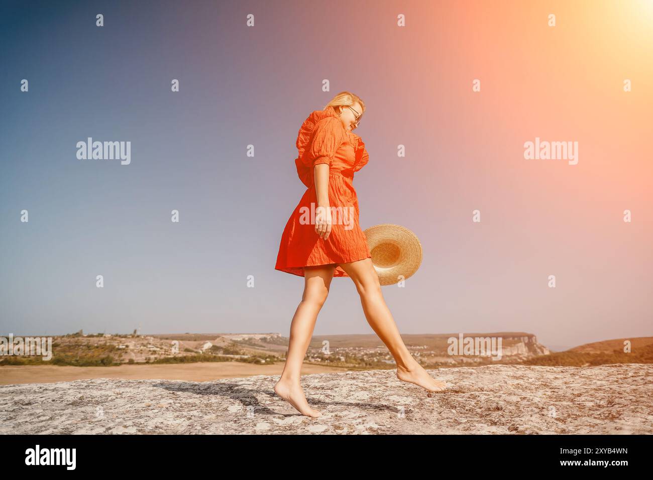Girl in red dress walks hi-res stock photography and images - Alamy