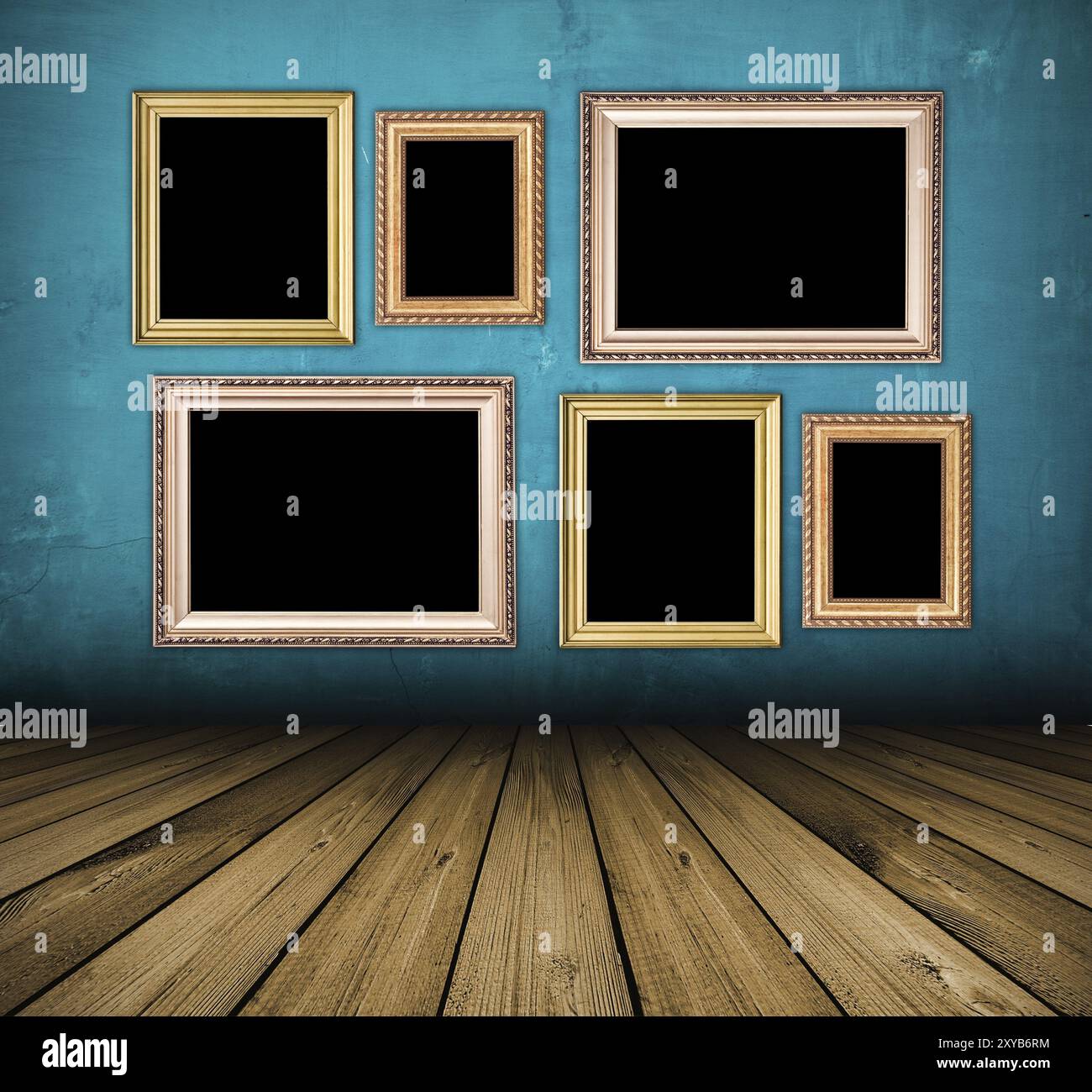 Vintage blue interior with empty frames hanging on the wall Stock Photo ...