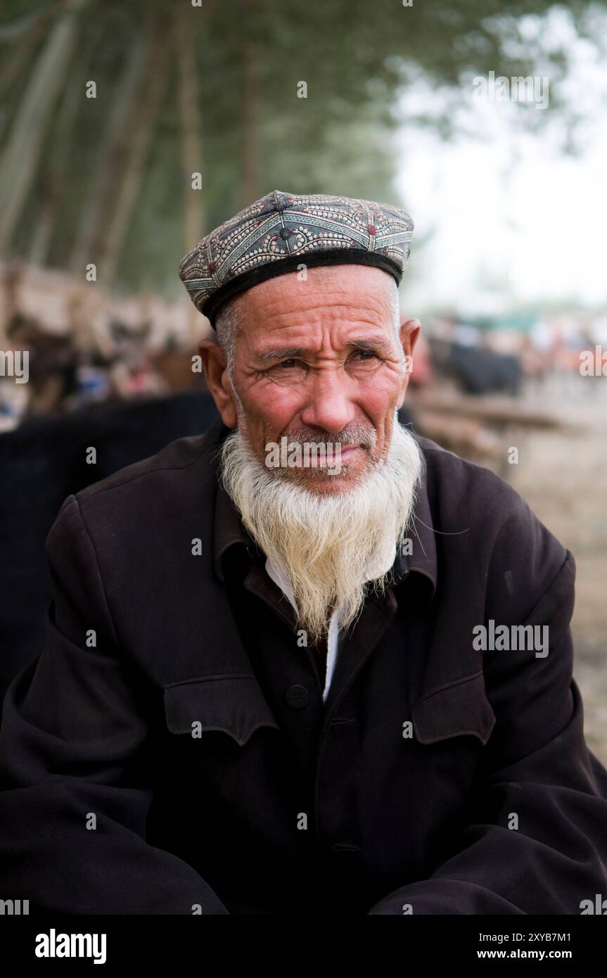 Portrait of an Uyghur man taken in the old city of Kashgar, Xinjiang, China. Stock Photo