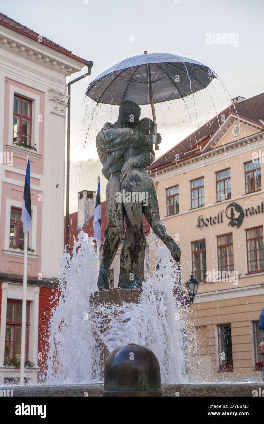 Statue of kissing students under umbrella near the town hall in Tartu, Estonia, Europe Stock Photo