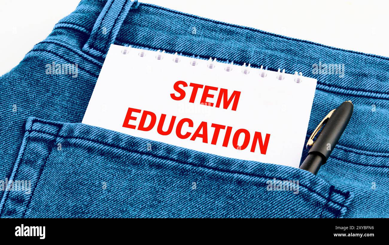 STEM Education. Science Technology Engineering Mathematics. STEM EDUCATION words on a notebook in red letters in jeans Stock Photo