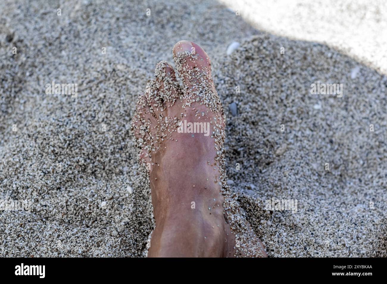 feet on beach sand Stock Photo