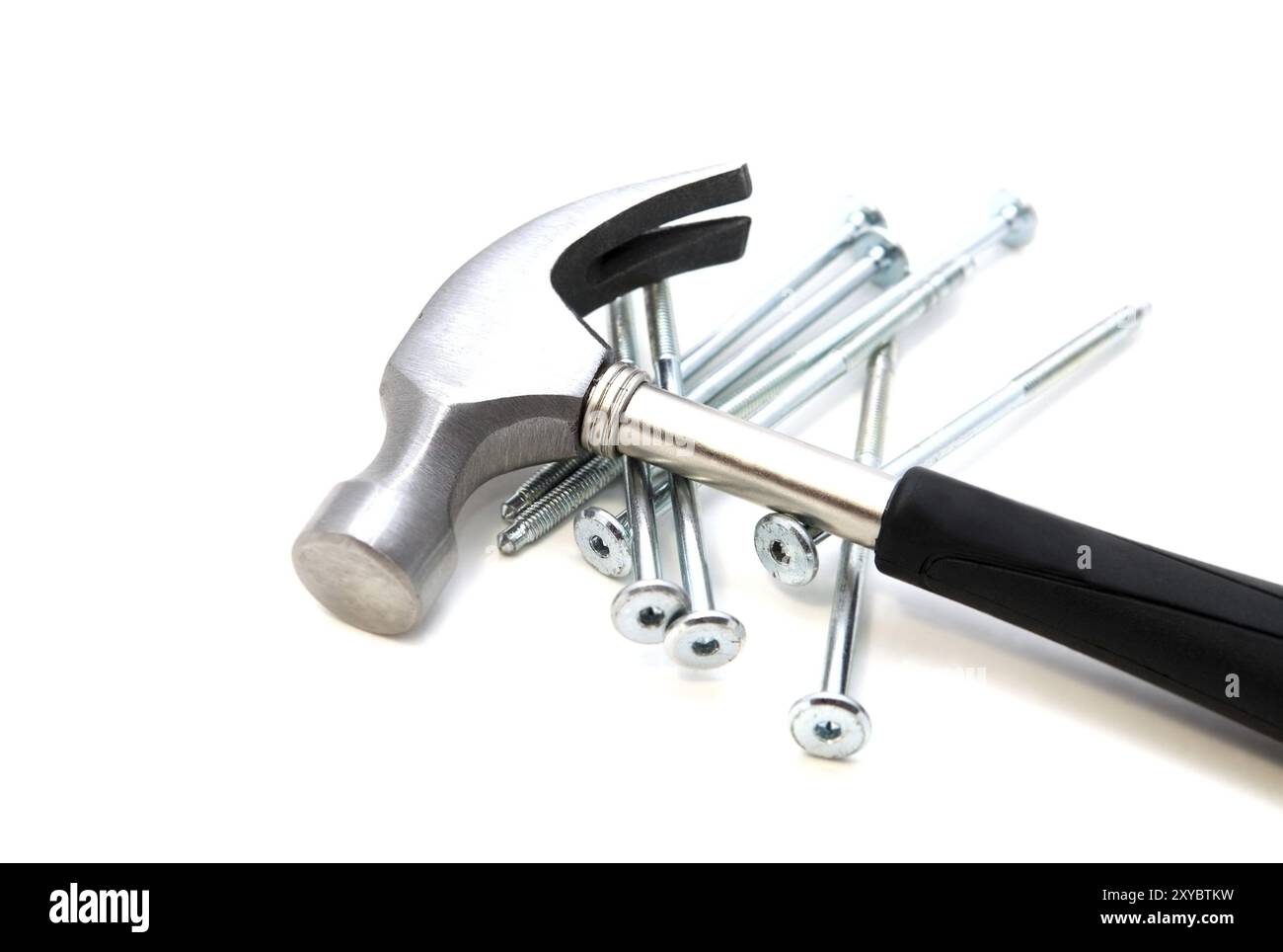 Metal hammer and nails on white background Stock Photo - Alamy