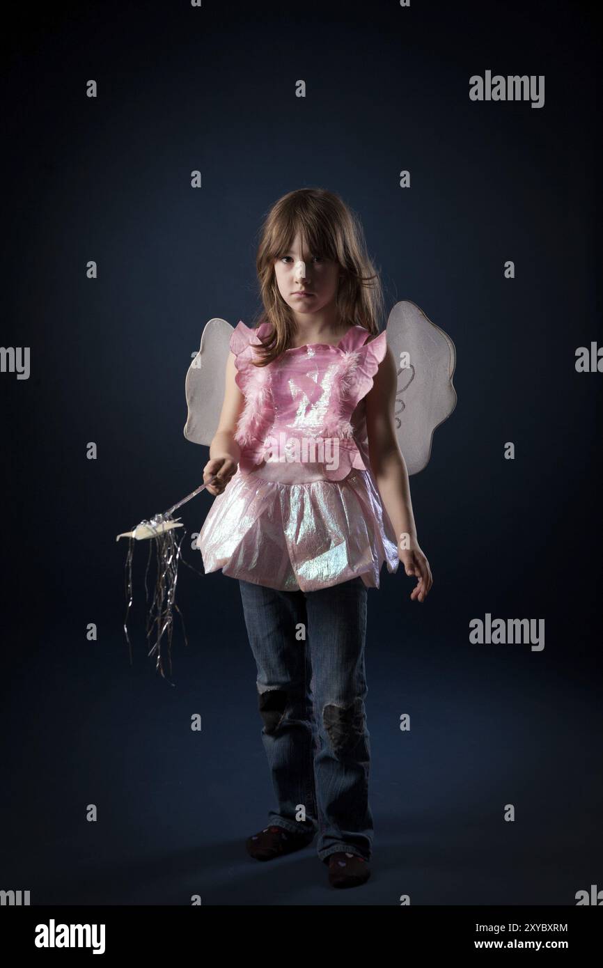 Little girl dressed up as a fairy with a magic wand Stock Photo - Alamy