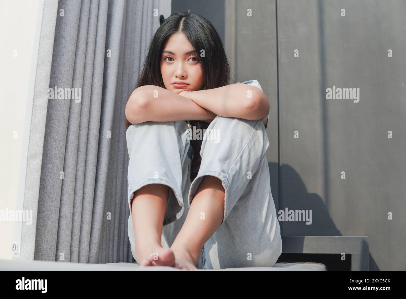 Asian teenager sitting on floor hi-res stock photography and images - Alamy