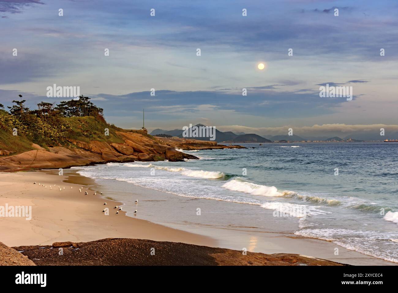 The moonrise over the Rio de Janeiro sea seen from the Arpoador stone ...