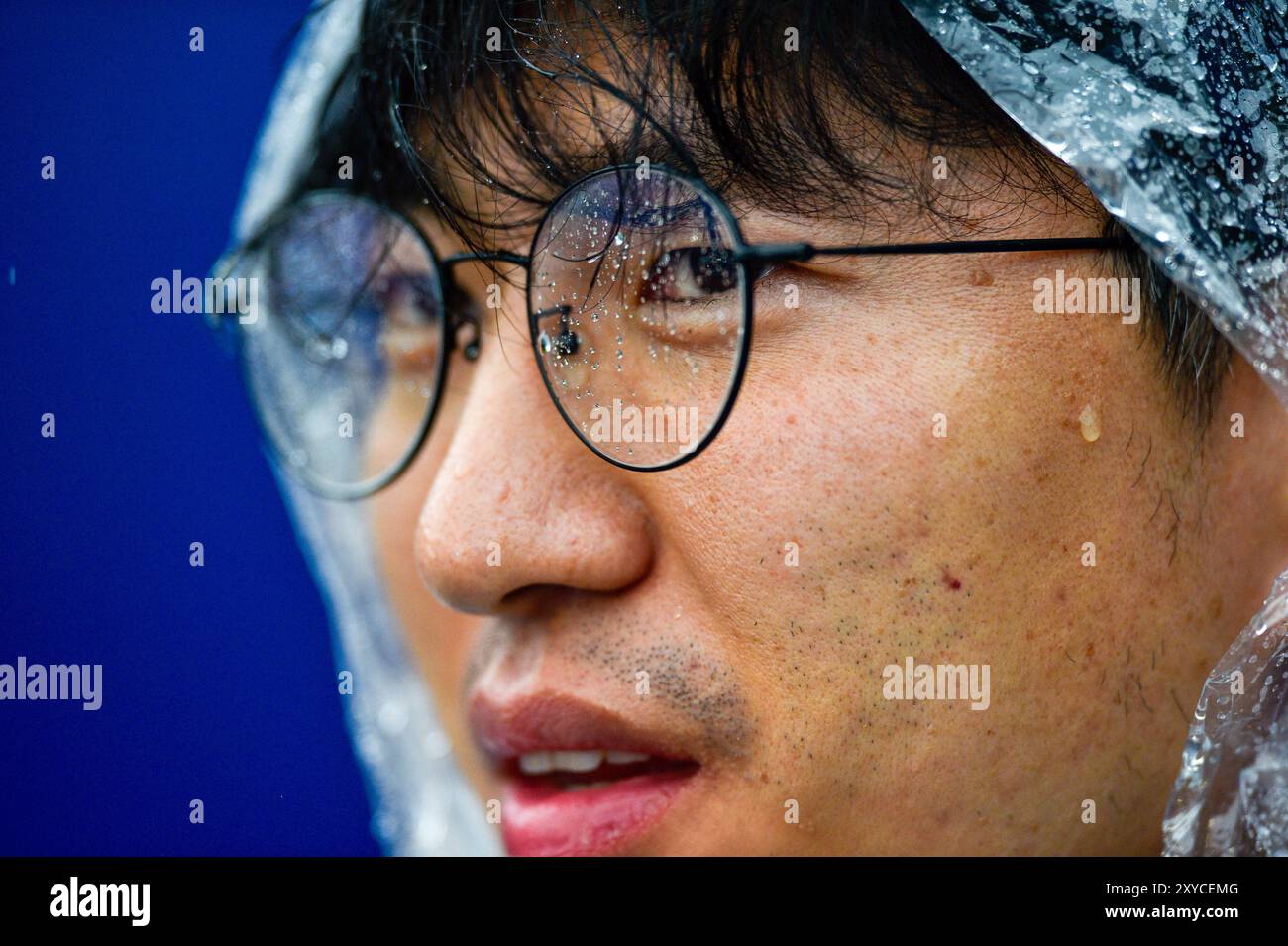 PARIS, FRANCE26 July 2024 Attendees wearing rain coats ahead of the