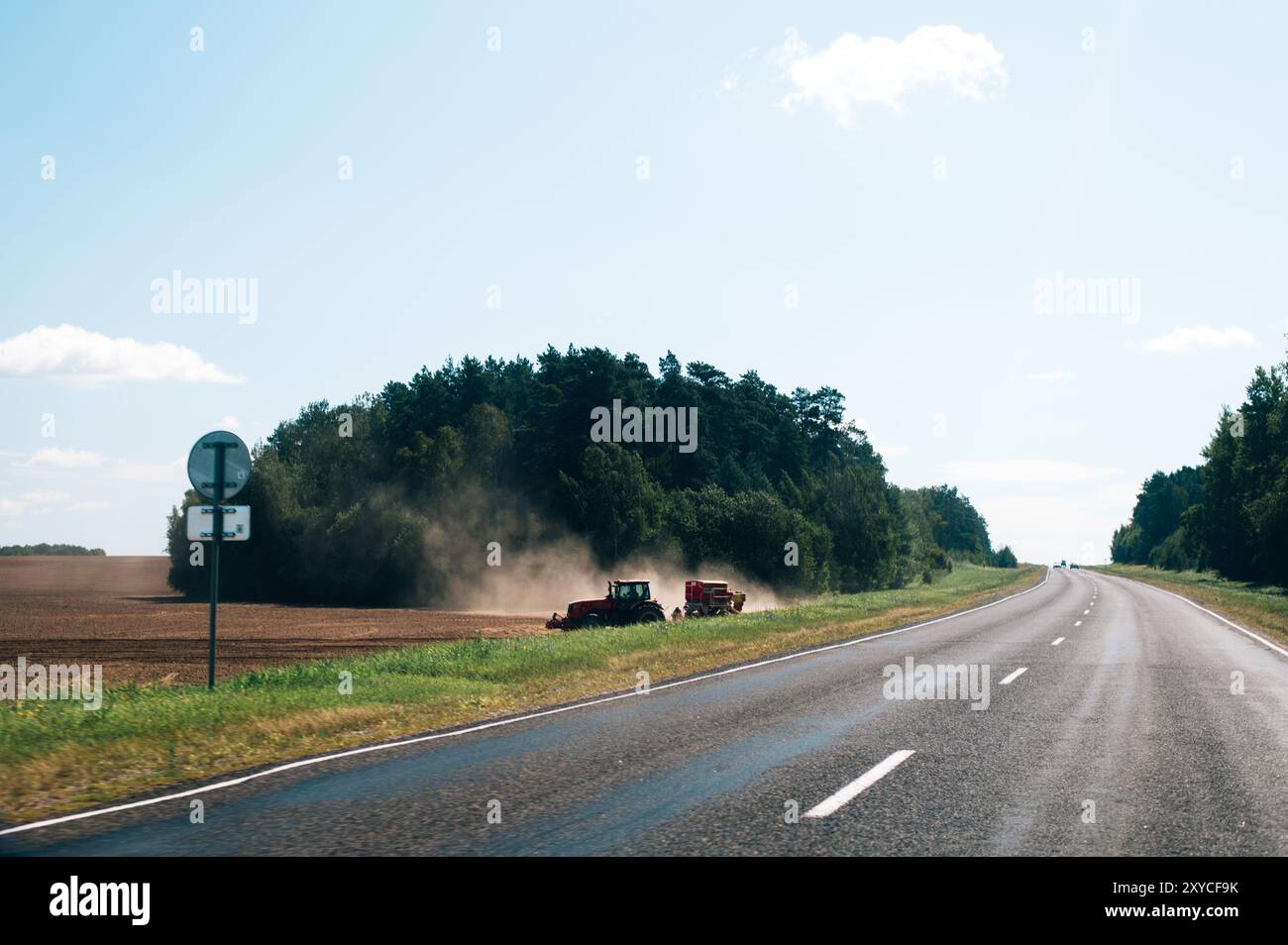tractors in the field harvesting Stock Photo - Alamy