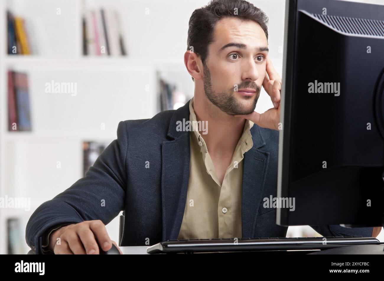 Man Looking Computer Surprised man looking computer screen hi-res stock photography and ...