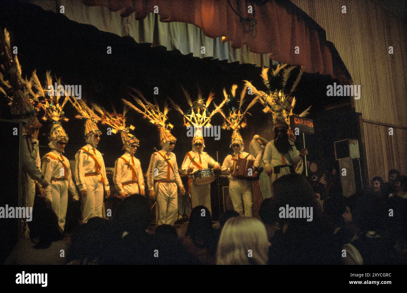 Biddy Boys in Killorglin celebrating the Celtic Saint Brigit or Brigid, who was a pagan goddess of pre-Christian Ireland. The celebration last for several days. At the end of the festival there is a competition for the best dressed Biddy Boy team. Killorglin, County Kerry, Eire, Southern Ireland February 1972 1970s HOMER SYKES Stock Photo