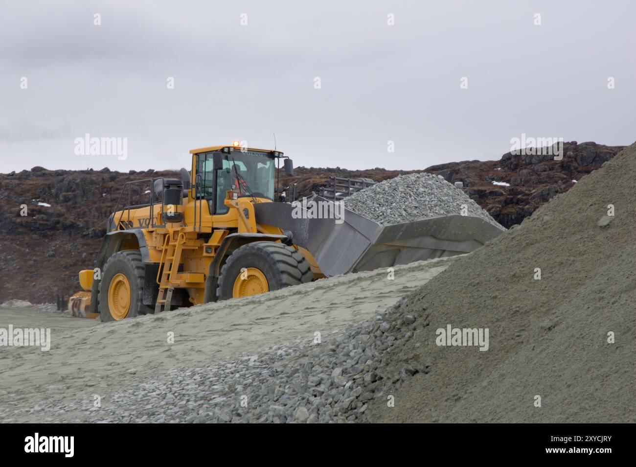 Digger at Seqi olivine mine, Greenland Stock Photo